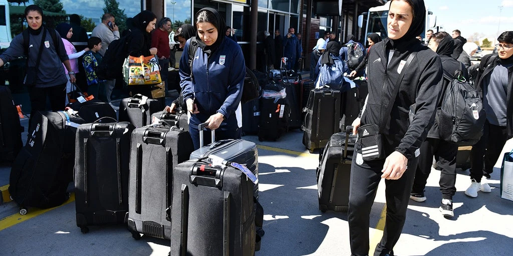 Iranian women's soccer team returns home after asylum offers in Australia