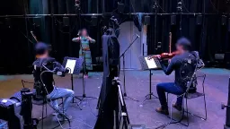 Robotic Exoskeletons Enhance Violinists' Musical Timing