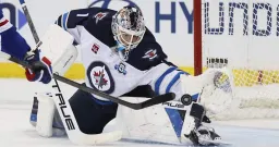 Winnipeg Jets' Comrie Shines, Easing Pressure on Hellebuyck